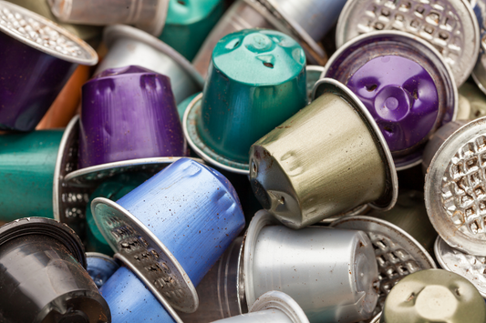 pile of different coloured coffee pods