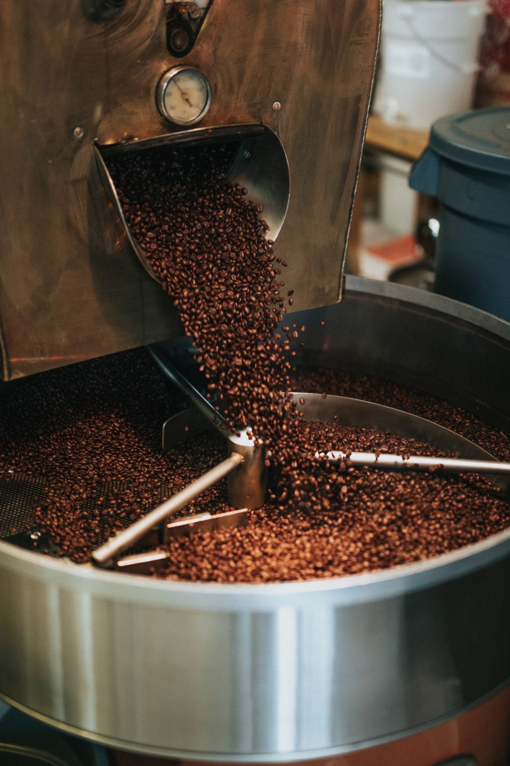Coffee beans pouring from roasting drum